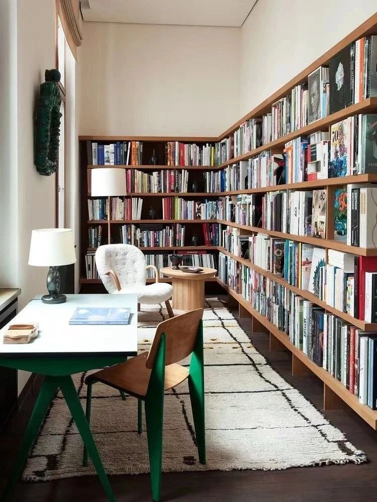 Bookshelf wall designed by Charlotte Perriand